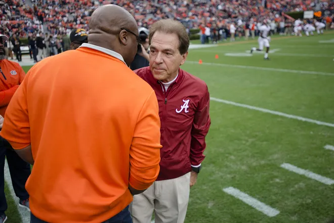 Alabama head coach Nick Saban greets Bo Jackson before the Iron Bowl NCAA football game between Auburn and Alabama on Saturday, Nov. 25, 2017, in Auburn, Ala.