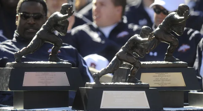 Cam Newton's Heisman Trophy joins those of Bo Jackson and Pat Sullivan on stage during the National Championship Celebration at Jordan Hare Stadium on the Auburn University campus in Auburn, Ala. on Saturday January 22, 2011.(Montgomery Advertiser, Mickey Welsh)