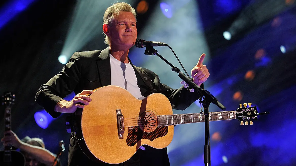 Randy Travis with a guitar