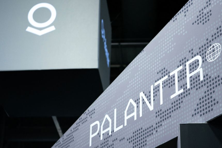 Signage for Palantir is seen during the Association of the United States Army annual meeting and exposition at the Walter E. Washington Convention Center in Washington, DC, on October 14, 2024.