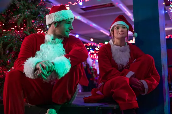 Connor Swindells and Olivia Holt play London department store co-workers who plan to rob their job in the Christmas rom-com