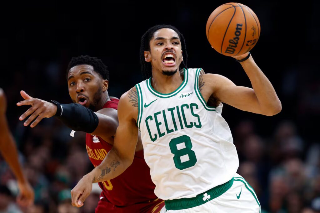 Josh Minott's Celtics got the better of Donovan Mitchell (left) and the Cavaliers on Wednesday night at TD Garden.
