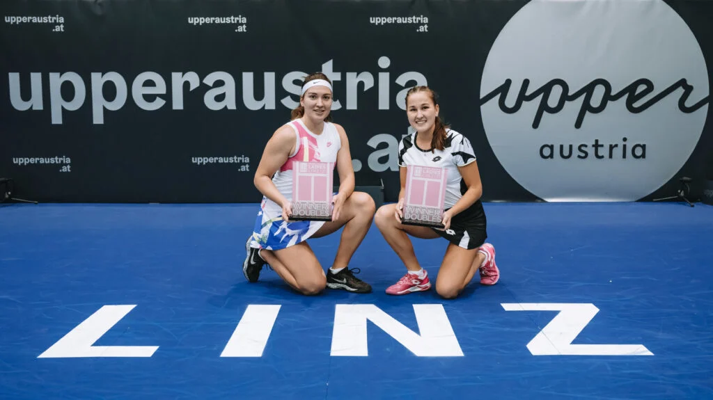 Natela Dzalamidze and Kamilla Rakhimova pose with the trophies after winning the WTA Upper Austria Ladies Linz tournament in 2021.