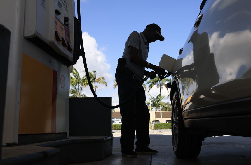 A customer pumps gas into their vehicle on October 24, in Miami, Florida. Gasoline prices have seen a spike as inflation rises.