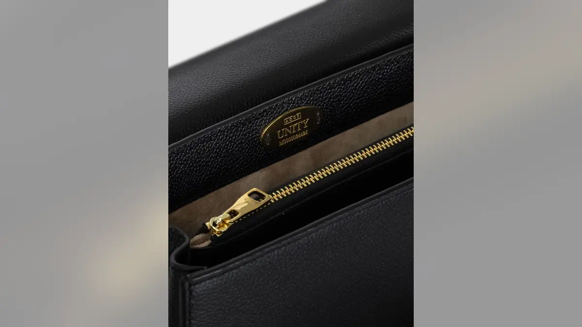 The limited edition purse is designed with a gold oval plaque hand-stitched into the interior, and engraved with a unique edition number, giving it a quiet hallmark of authenticity and lasting collectability, AGCF said.
