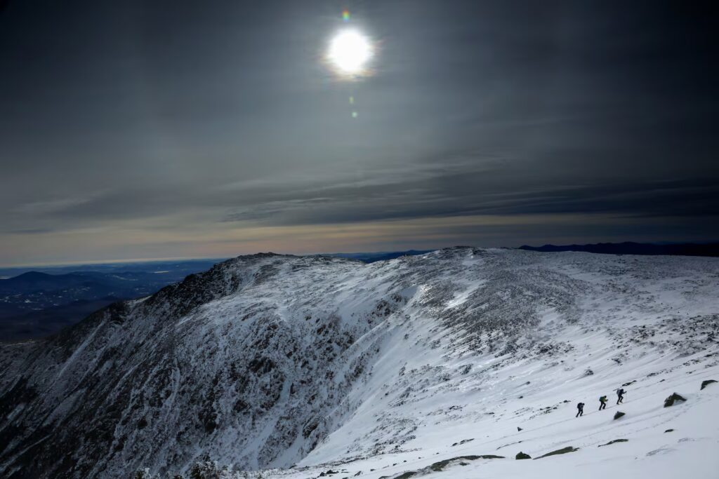 Three climbers make their way up a slope on Mount Washington on Dec. 21, 2019, in New Hampshire.