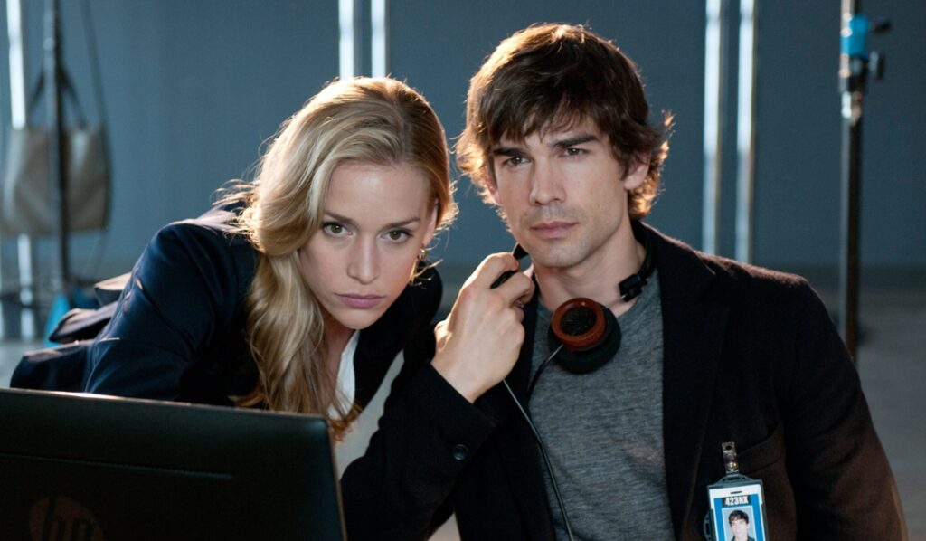 COVERT AFFAIRS, (from left): Piper Perabo, Christopher Gorham, 'On Air Promo', (Season 2), 2010-. photo: Christos Kalohoridis / © USA Network / Courtesy: Everett Collection