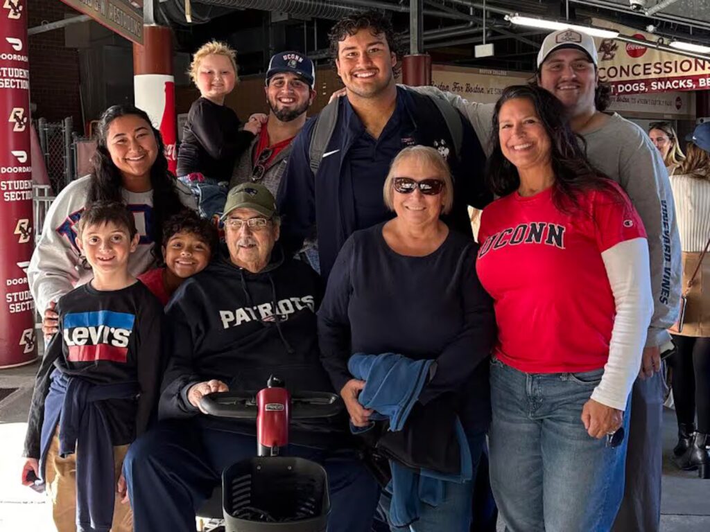 Ty Chan savored a moment with his family, including his niece Olivia, after UConn's game at Boston College on Oct. 18, 2025.