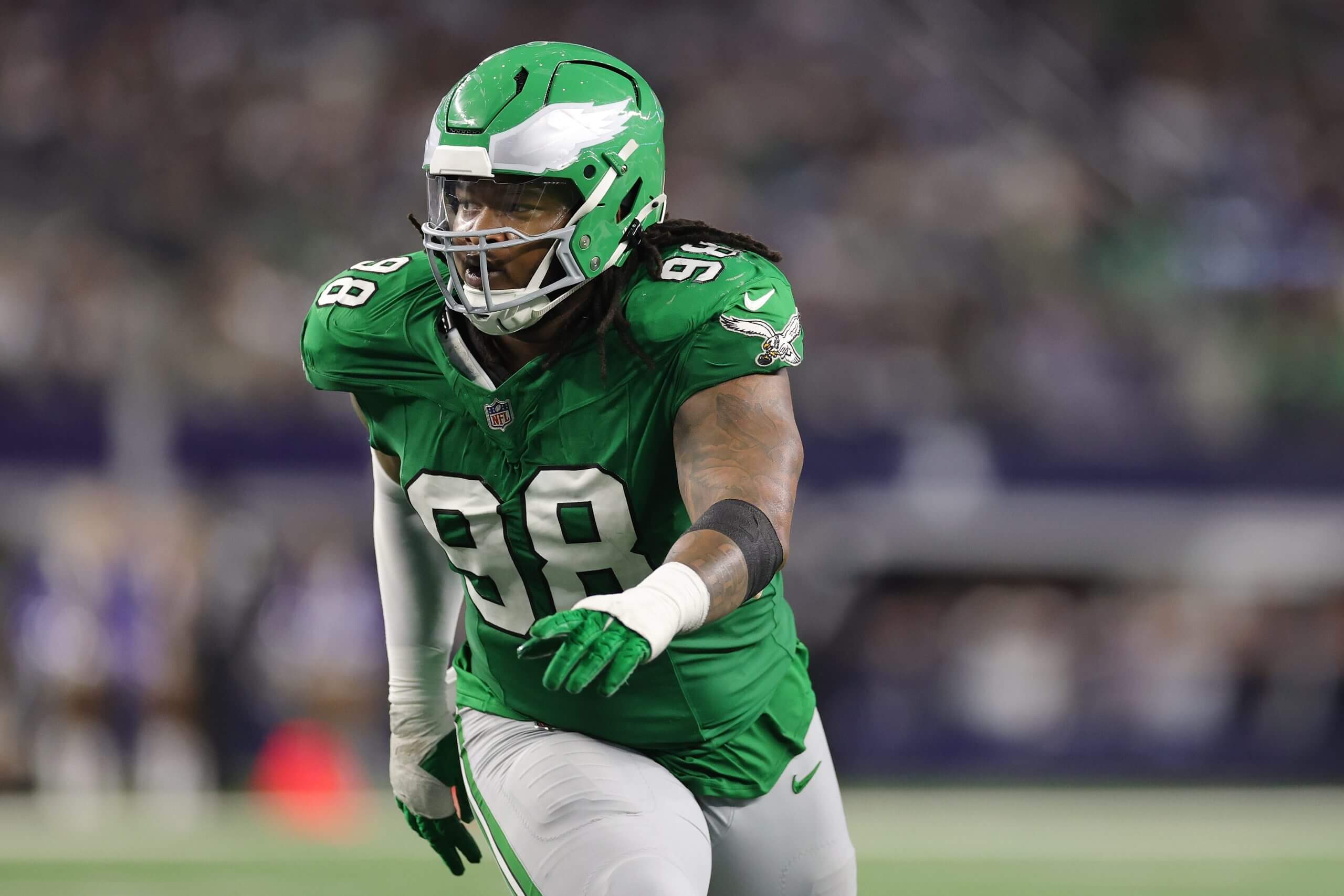 Jalen Carter #98 of the Philadelphia Eagles rushes the passer during a game against the Dallas Cowboys at AT&T Stadium on November 23, 2025 in Arlington, Texas.