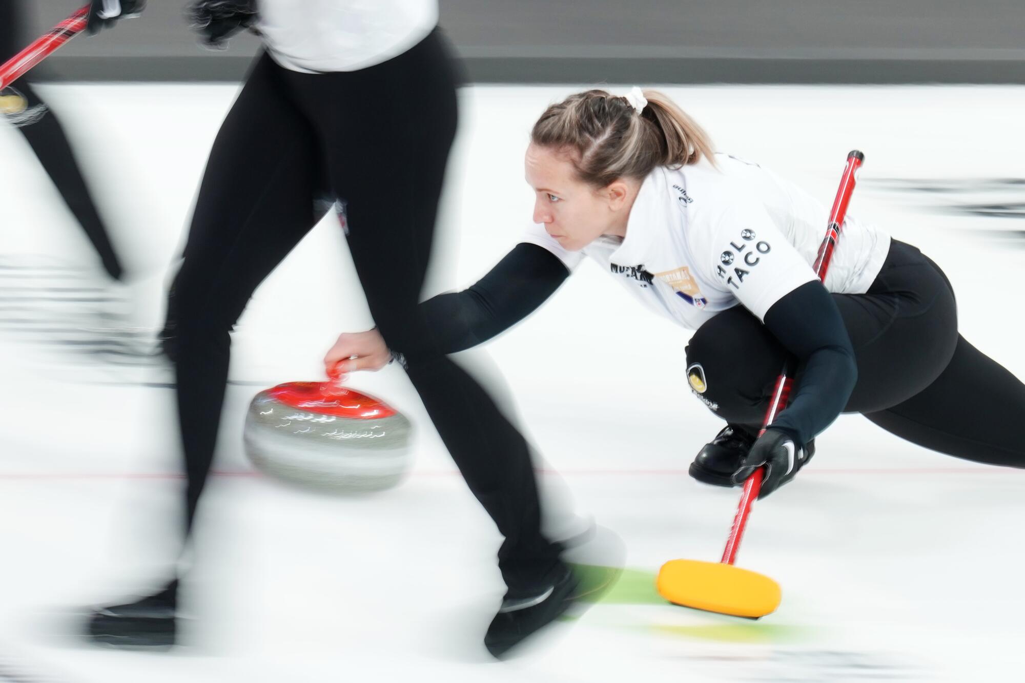 Rachel Homan throws a rock during Canadian Olympic curling trials.