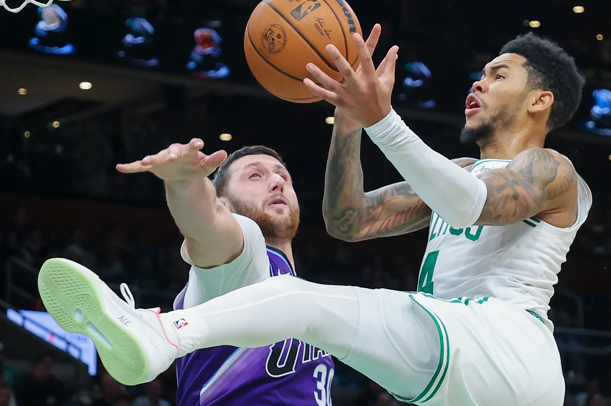 Boston, MA - November 3: Boston Celtics guard Anfernee Simons drives to the basket and is fouled by Utah Jazz center Jusuf Nurki in the fourth quarter at TD Garden on November 3, 2025. (Photo by Matthew J. Lee/The Boston Globe via Getty Images)