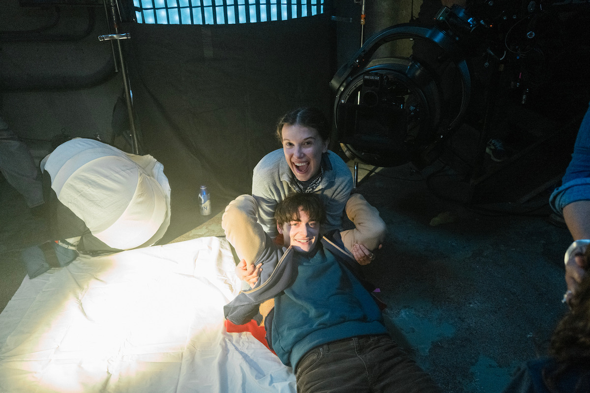 Millie Bobby Brown as Eleven and Noah Schnapp as Will Byers behind the scenes of ‘Stranger Things 5’