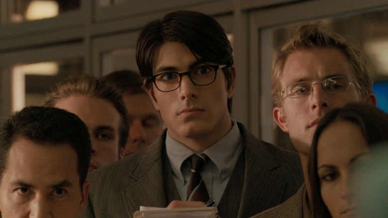 Clark Kent among a crowd of reporters in Superman Returns