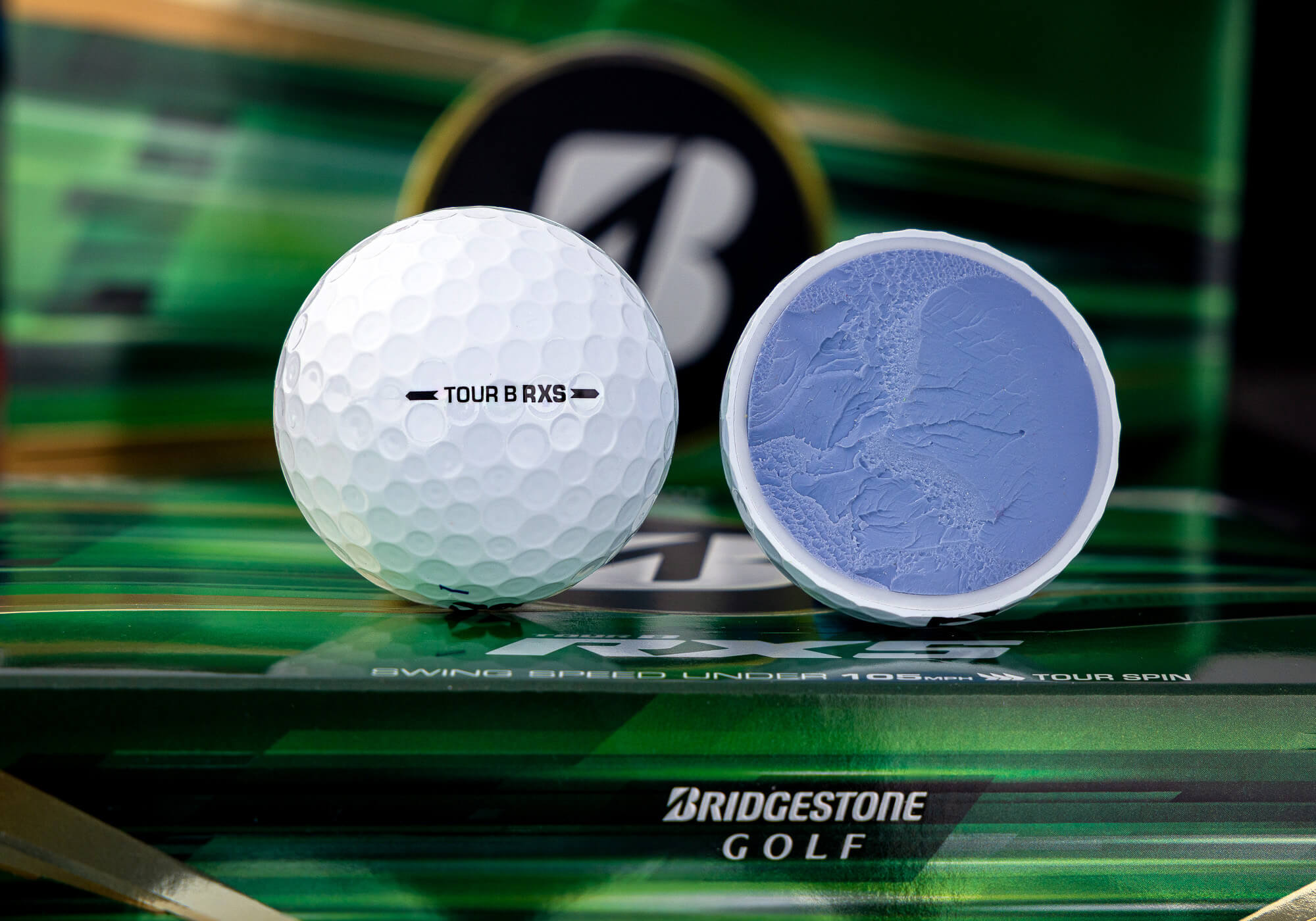Bridgestone TOUR B RXS golf ball with visible core.