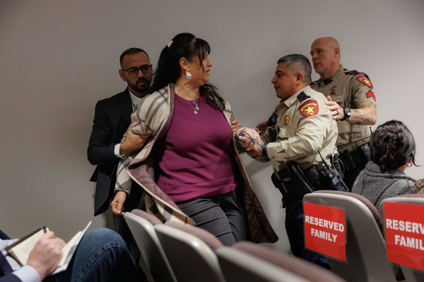 Officers escort Velma Duran from the courtroom as she yells during Adrian Gonzales's trial on January 13. Duran's sister Irma Garcia was one of two teachers killed in the Robb Elementary mass shooting.