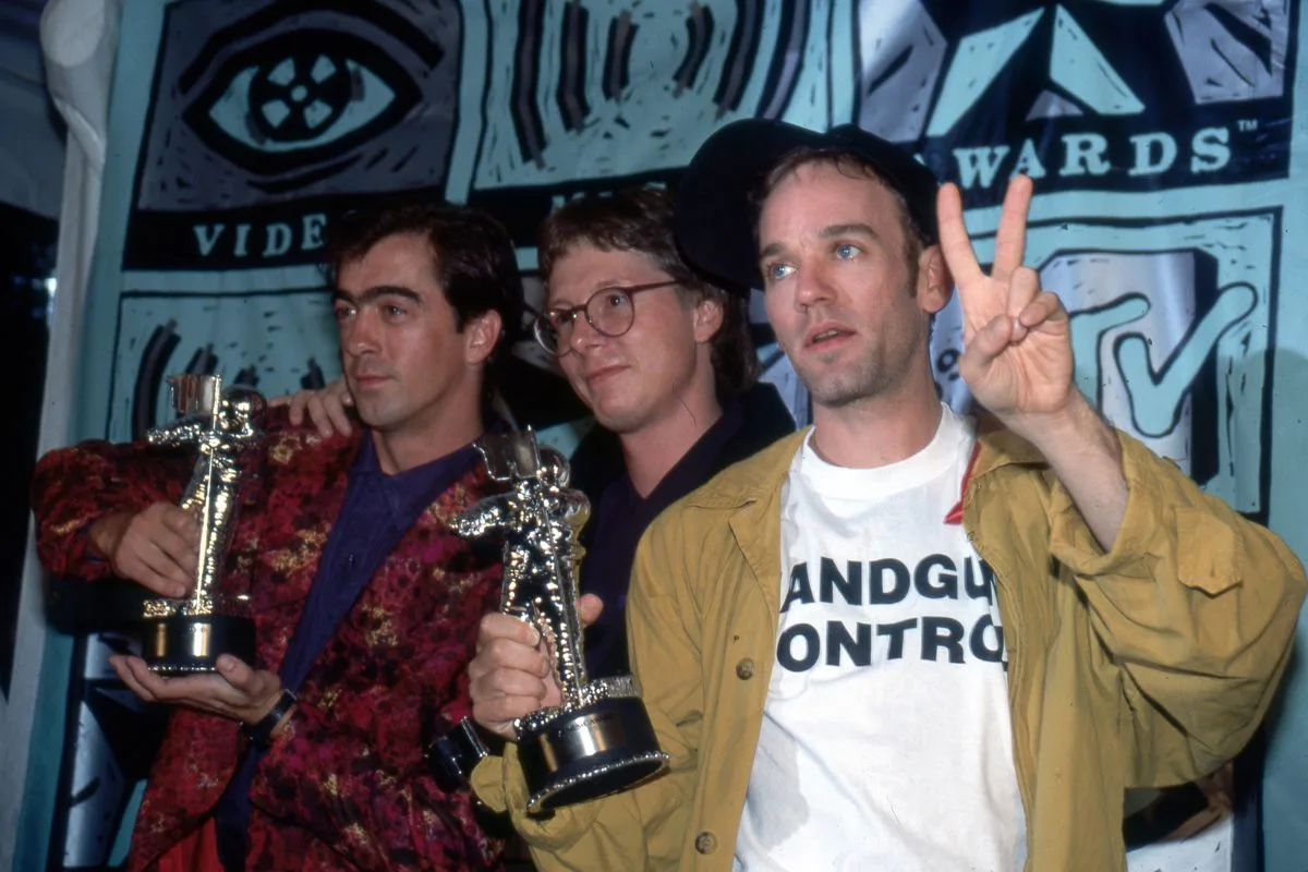 R.E.M., rock group, 1991. L-R Bill Berry, Mike Mills and Michael Stipe of R.E.M. group attend the Eighth Annual MTV Video Music Awards on September 5, 1991