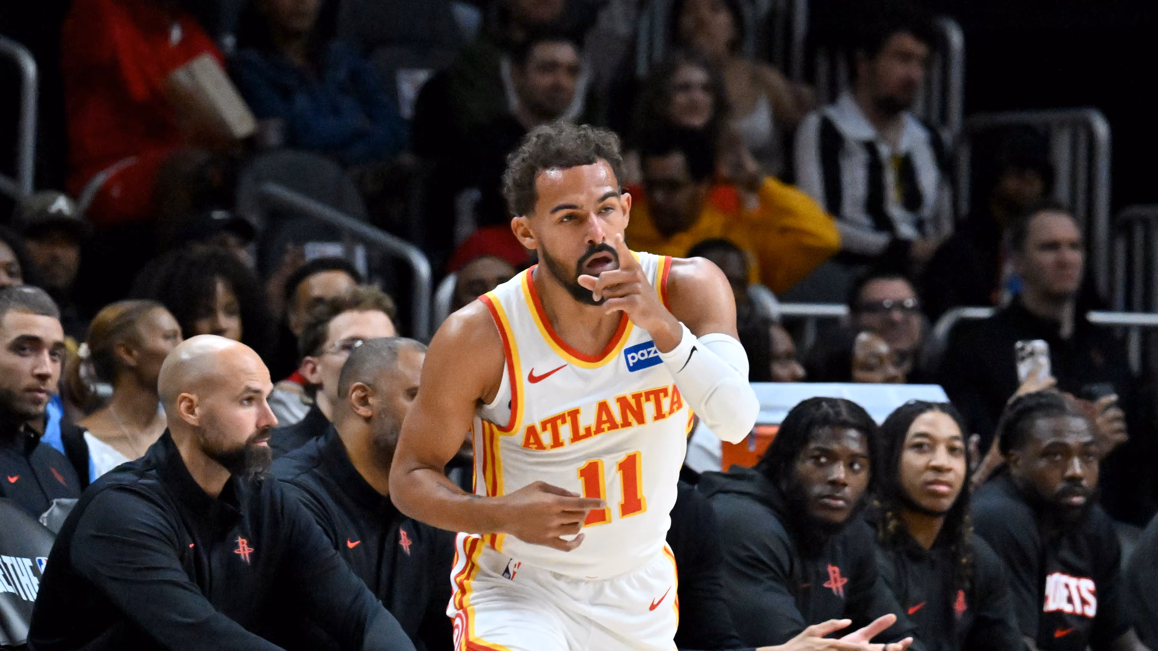 Atlanta Hawks guard Trae Young celebrates after scoring a 3-point basket during the first half in a preseason NBA basketball game at State Farm Arena, Thursday, October 16, 2025, in Atlanta. Young has played in just 10 games this season due to injuries. (Hyosub Shin/AJC)
