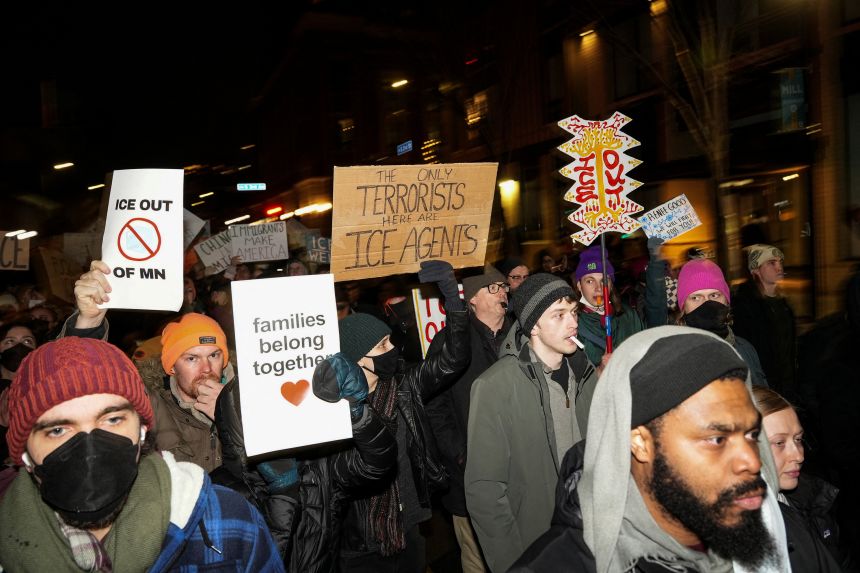 People march in Minneapolis on Friday during a demonstration against increased immigration enforcement, days after the fatal shooting of Renee Nicole Good by a US Immigration and Customs Enforcement agent.
