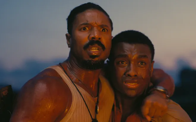 Smoke (Michael B. Jordan, left) and Sammie (Miles Caton) endure a horrific night in