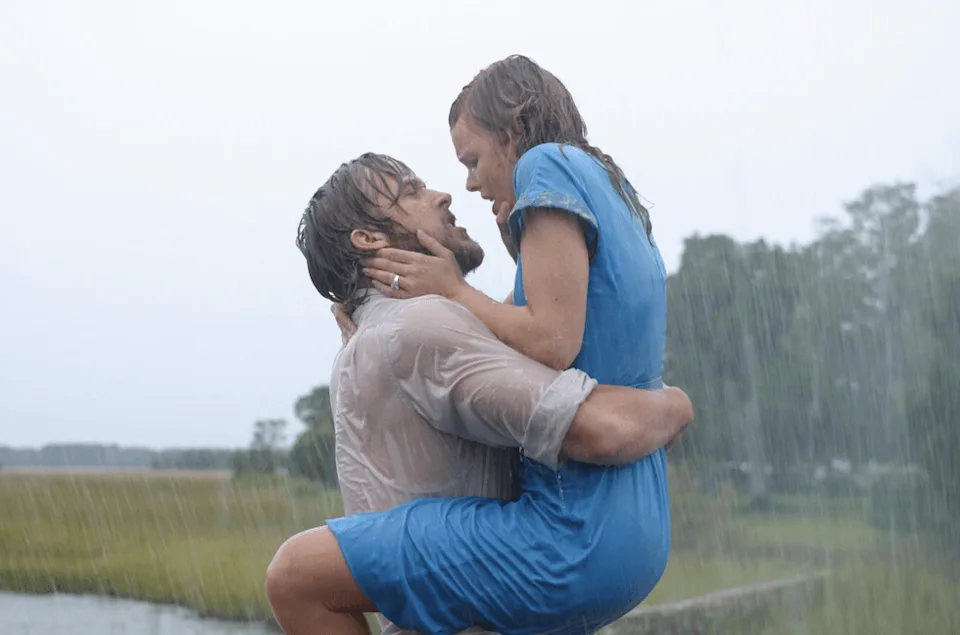 Couple embracing passionately in the rain with trees in the background. | IMDB