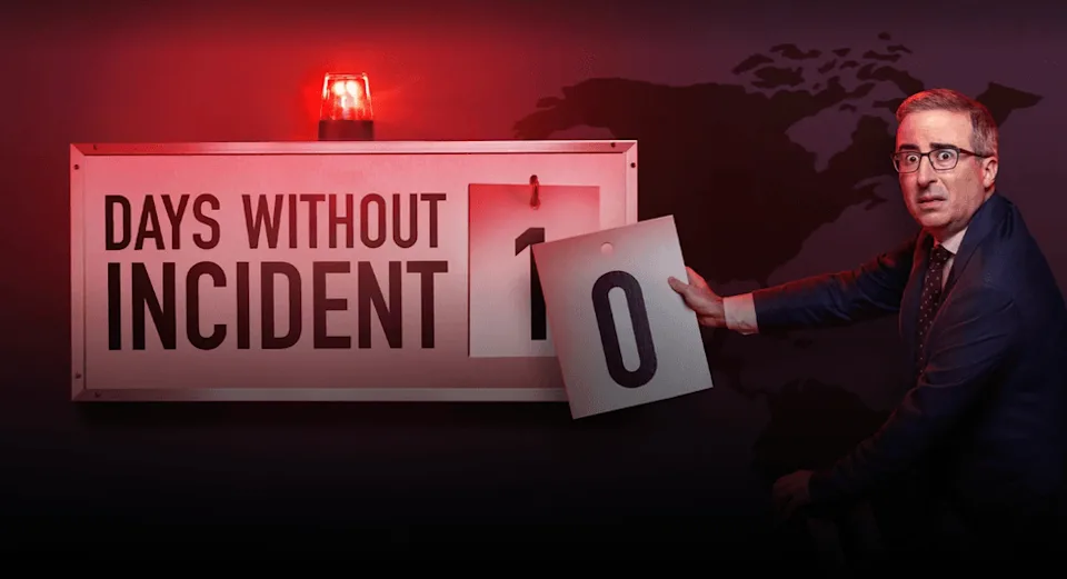 Man changing sign from 1 to 0 days without incident, red light flashing. | IMDB