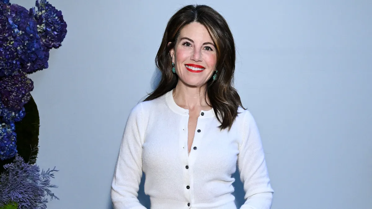 Monica Lewinsky wears a white cardigan on red carpet