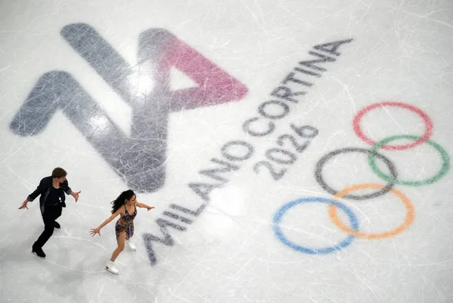 Madison Chock of United States and Evan Bates of United States perform during the ice dance rhythm dance during the Milano Cortina 2026 Olympic Winter Games at Milano Ice Skating Arena.