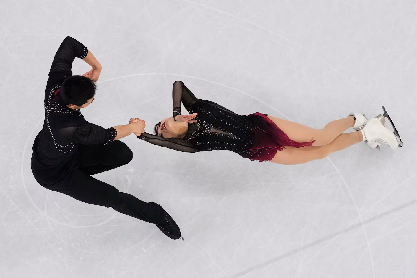 Emily Chan and Spencer Akira Howe of the United States compete during the pairs short program Sunday.