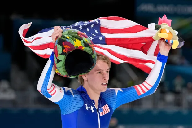 Gold medalist Jordan Stolz of the U.S. celebrates after the men's 1,000-meter speedskating race at the 2026 Winter Olympics on Wednesday, Feb. 11, 2026, in Milan. (AP Photo/Ben Curtis)