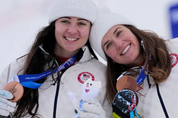 The United States' Jacqueline Wiles, left, and Paula Moltzan show their bronze medals after the women's team combined event at the 2026 Winter Olympics on Tuesday, Feb. 10, 2026, in Cortina d'Ampezzo, Italy. (AP Photo/Andy Wong)