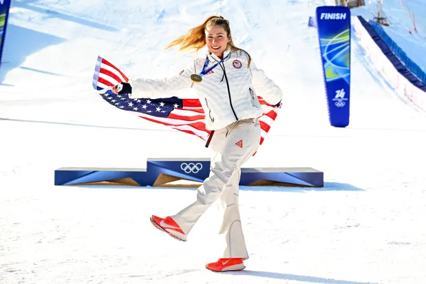 Mikaela Shiffrin celebrates after winning the gold medal in the women's slalom competition at the 2026 Milan Cortina Winter Olympics in Cortina d'Ampezzo, Italy, on Feb. 18, 2026. (James Hill/The New York Times)
