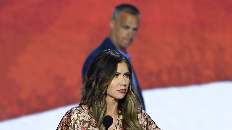 South Dakota Republican Governor Kristi Noem takes part in a sound check as political commentator Corey Lewandowski looks on at the Fiserv Forum ahead of the 2024 Republican National Convention on July 14, 2024.