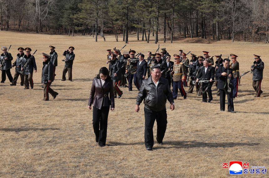 North Korea's KCNA news agency shows leader Kim Jong Un (R) and his daughter Kim Ju Ae heading to the shooting range, at an undisclosed place in North Korea.