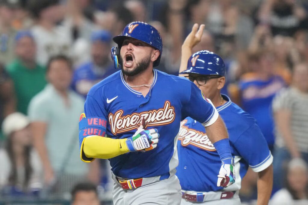 Venezuela's Wilyer Abreu celebrates after he hit a go-ahead homer during a win over Japan in a World Baseball Classic quarterfinal on Saturday.