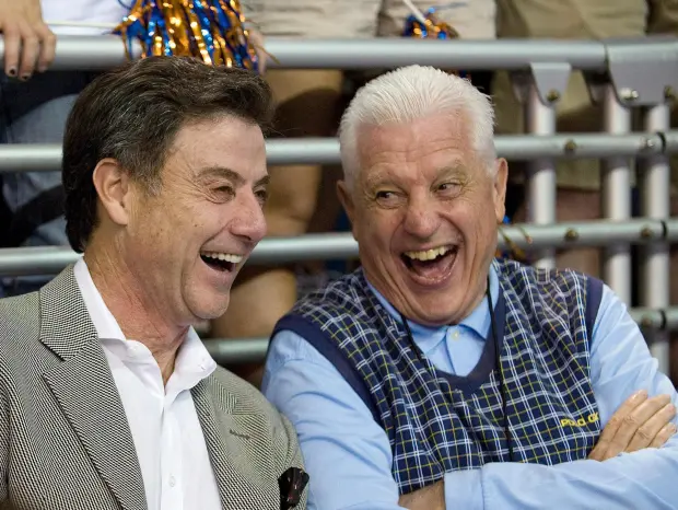 Bill Donovan Sr., right, has a laugh with Louisville coach Rick Pitino during Florida's 69-49 victory over Georgia Southern on Nov. 18, 2009, in Gainesville, Fla. (AP Photo/Phil Sandlin)