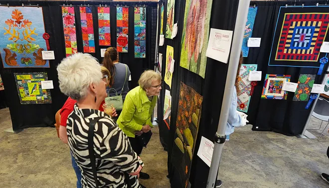 Visitors enjoy looking around the Garden Quilt Show on March 21, 2026, at Reiman Gardens in Ames, Iowa.