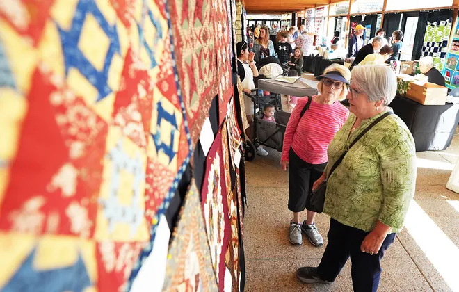 Rose Reicherts of New Hampton and Sharon Weber of Ames look around the Garden Quilt Show on March 21, 2026, at Reiman Gardens in Ames, Iowa.
