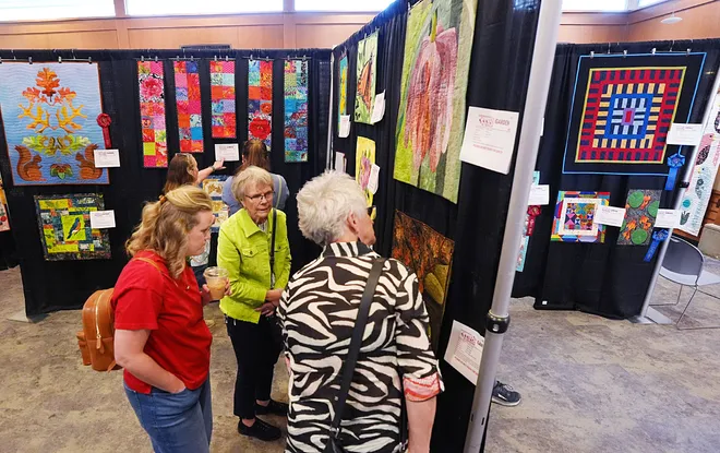 Visitors enjoy looking around the Garden Quilt Show on March 21, 2026, at Reiman Gardens in Ames, Iowa.