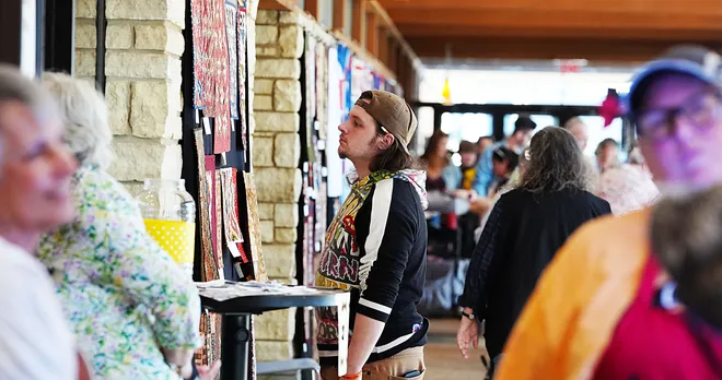 Visitors enjoy looking around the Garden Quilt Show on March 21, 2026, at Reiman Garden in Ames, Iowa.