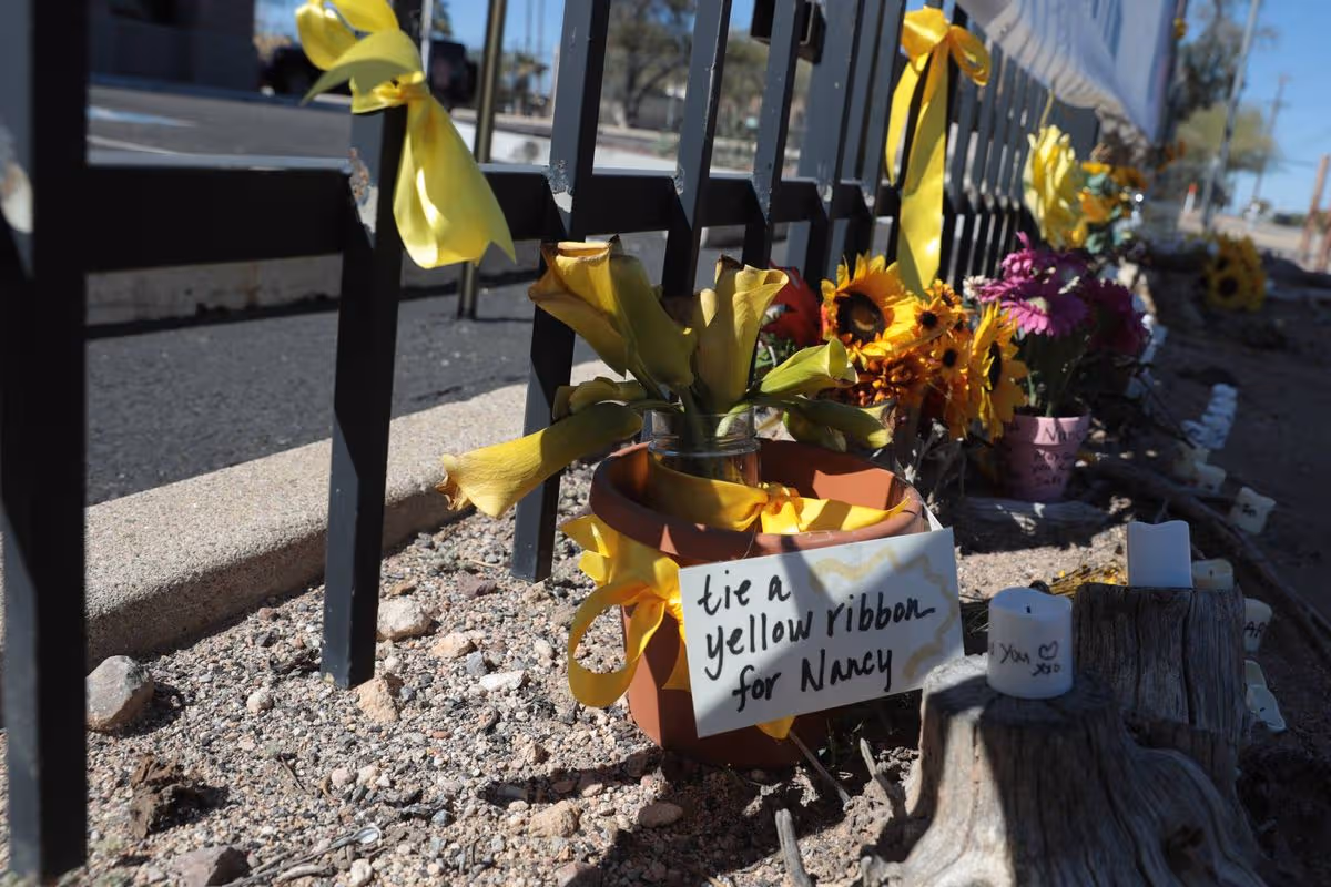 yellow ribbons and floral tributes