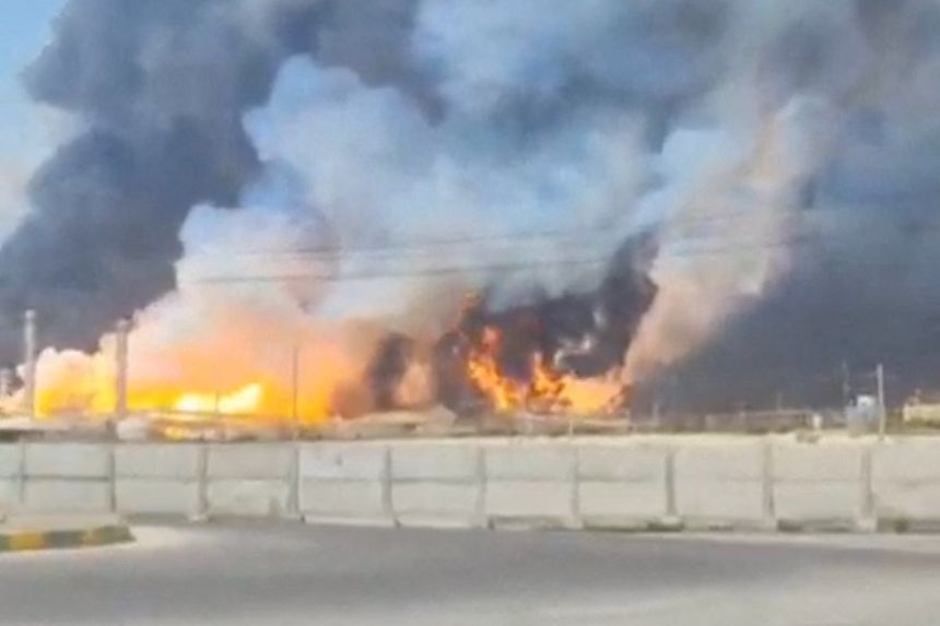 Smoke and fire rise near the South Pars gas field following an attack in Bushehr Province, Iran, on Wednesday, in this screengrab obtained from a social media video.