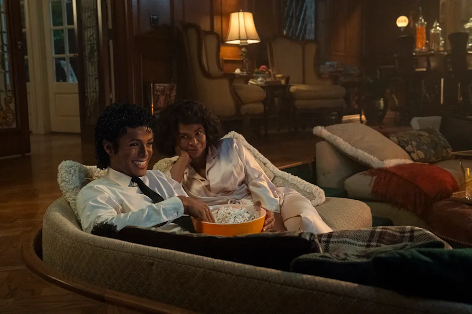 Jaafar Jackson and Nia Long on a couch.