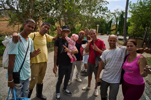 Formerly imprisoned men who were pardoned pose for a photo after their release from La Lima penitentiary in Guanabacoa, Havana, Cuba, Friday, April 3, 2026. (AP Photo/Ramon Espinosa)