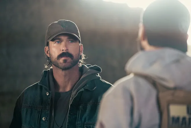 Riley Green as Garrett on