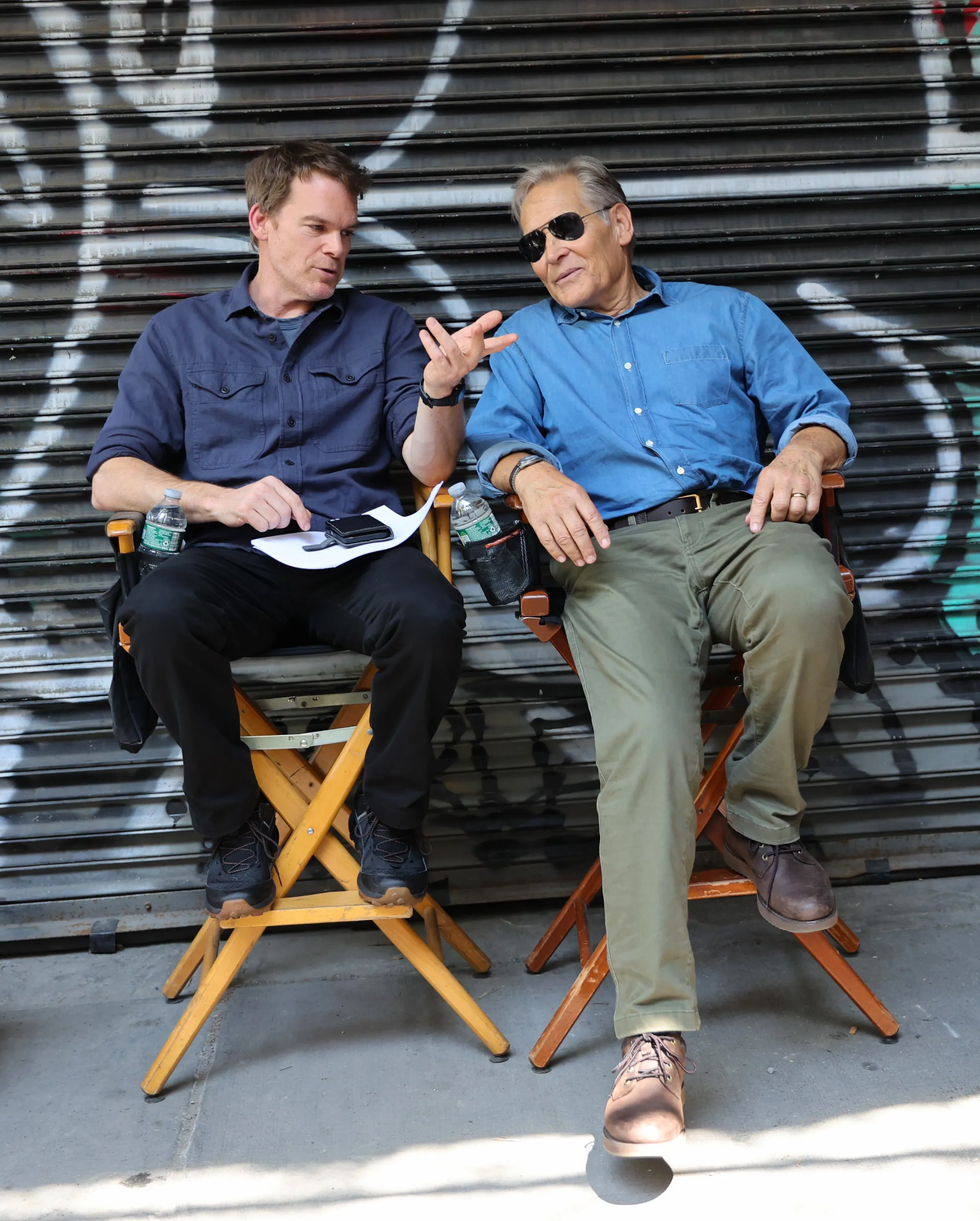 Michael C. Hall (left) and James Remar take a break while filming “Dexter: Resurrection” in downtown Manhattan.