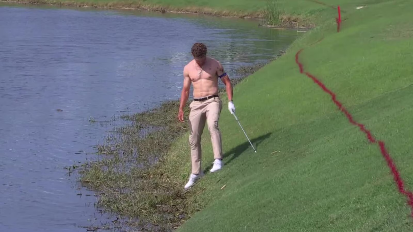 Michael Brennan goes shirtless in attempt to hit shot out of water at Zurich Classic