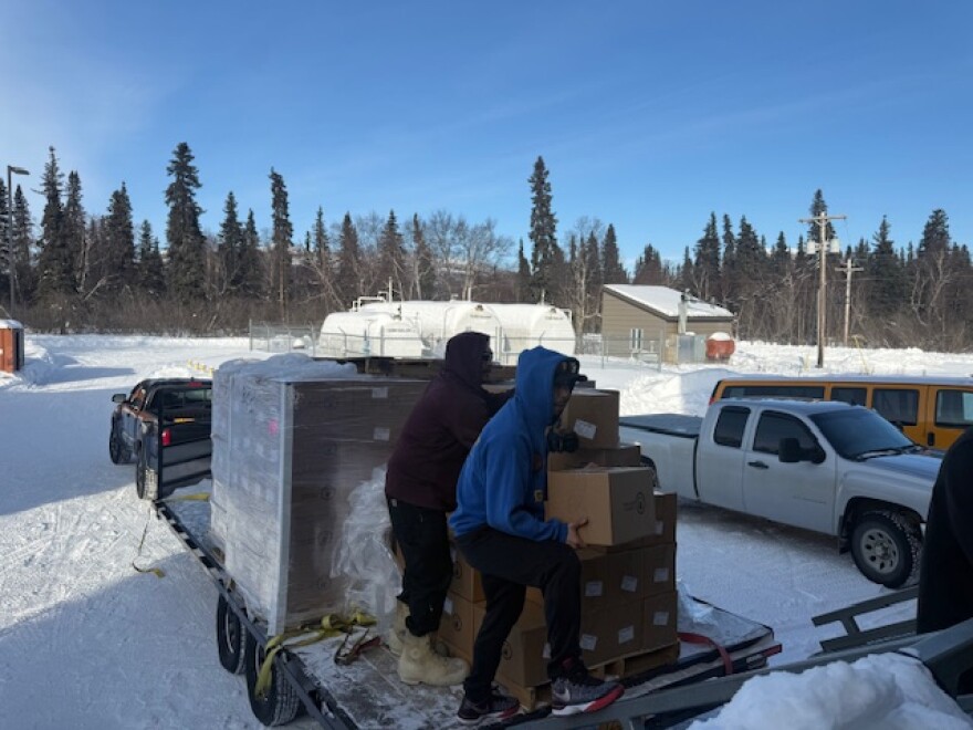 people unloading emergency boxes in Bethel AK 