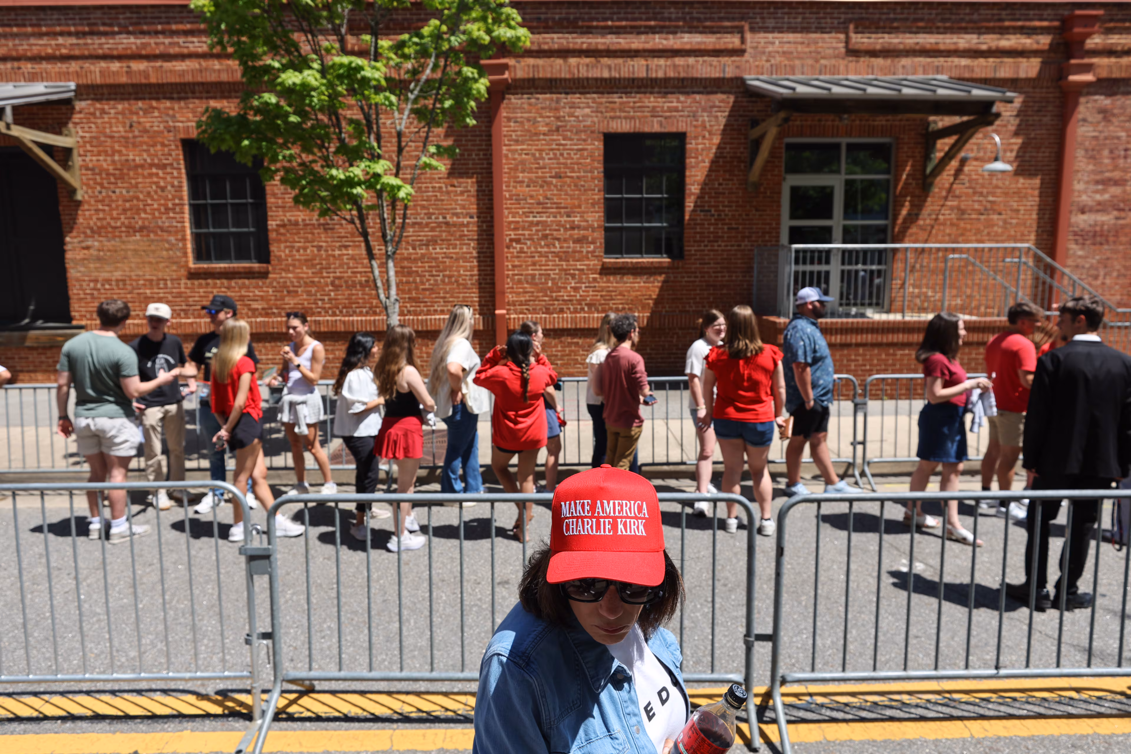 Students from various schools and universities wait in line for a Turning Point USA event featuring speakers including Vice President JD Vance at Akins Ford Arena in Athens, Ga., on April 14, 2026. (Arvin Temkar/AJC)