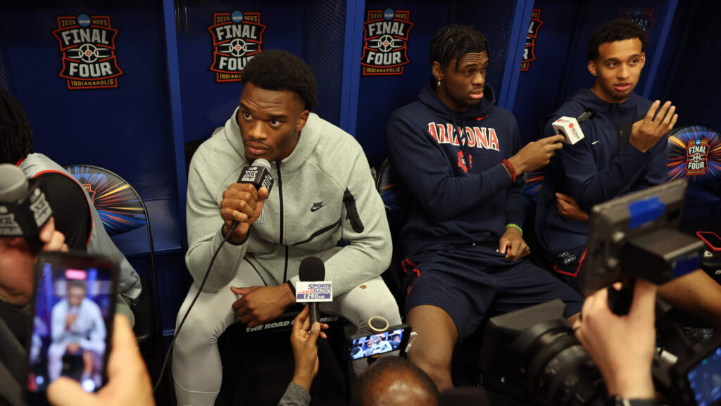 Tobe Awaka #30 of the Arizona Wildcats speaks to the media in the locker room during the Practice D...