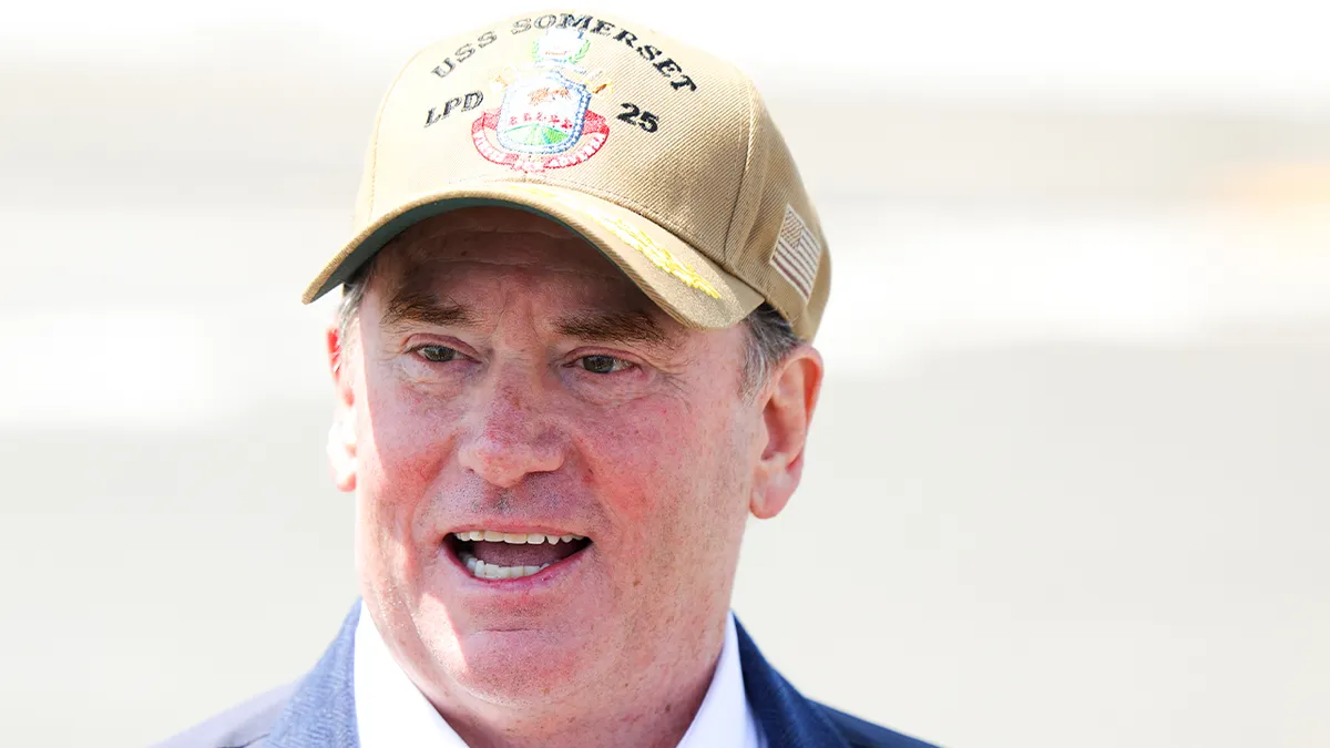 Navy Secretary John Phelan speaking to media on USS Somerset in National City California